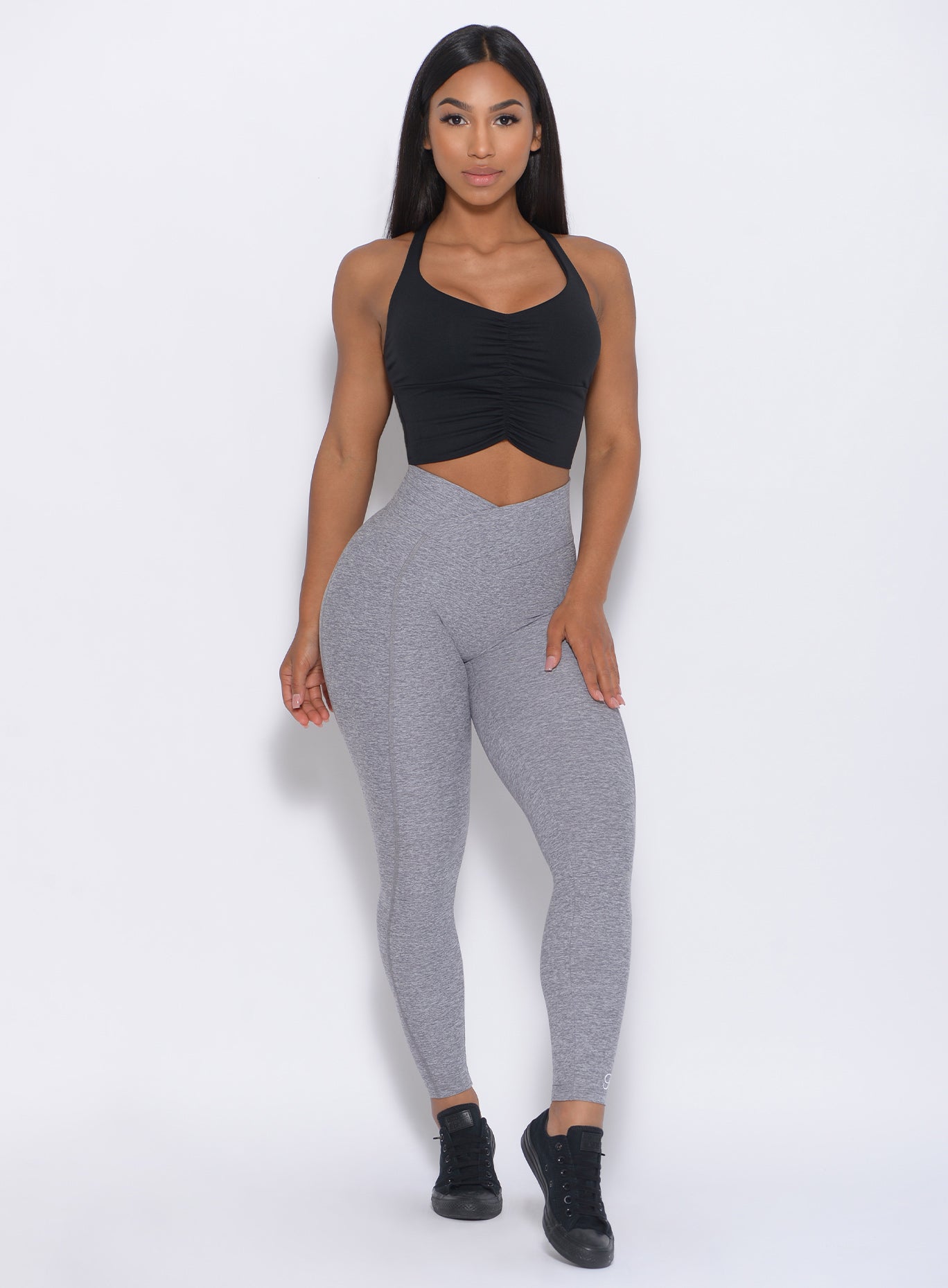 Front view of the model wearing our Brazilian Contour Legging in cloud color and a black top