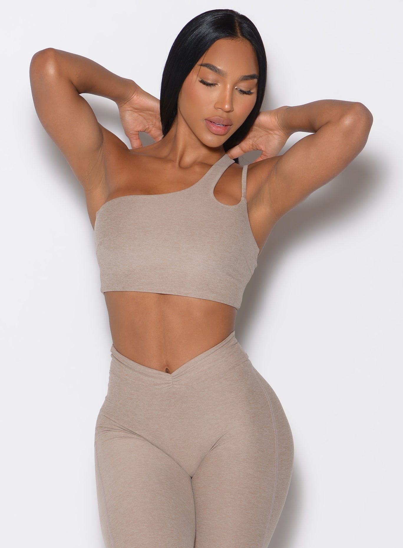 front view of a female in our Lateral Top and the matching leggings in Desert Taupe color