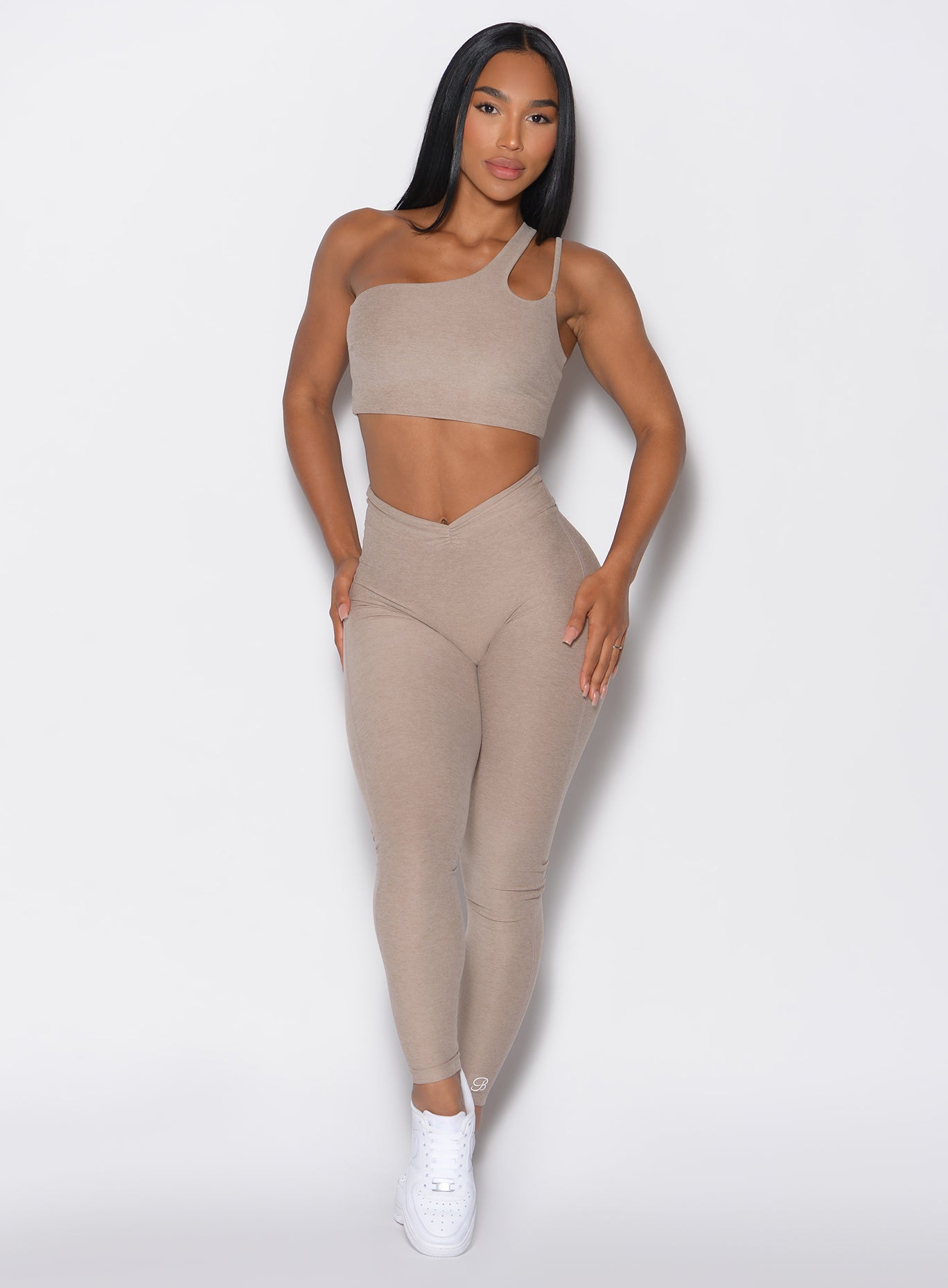 Model facing forward wearing our V Active Leggings and the matching Top in Desert Taupe color